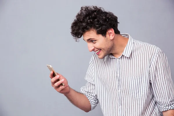 Serious man using smartphon — Stock Photo, Image