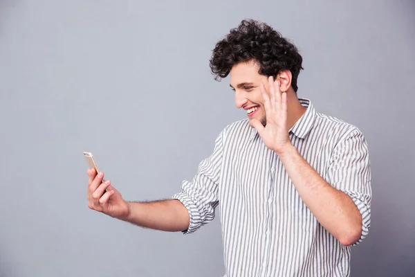 Man showing greeting gesture on web camera — Stock Photo, Image