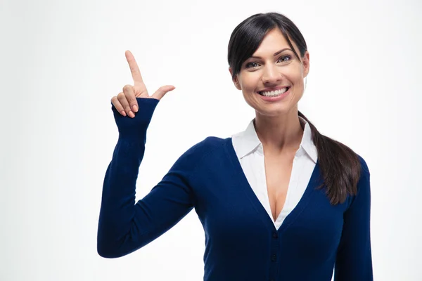 Mujer de negocios sonriente señalando con el dedo hacia arriba —  Fotos de Stock