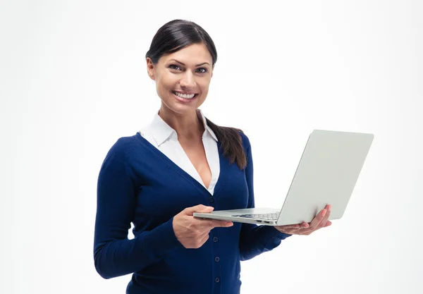 Happy businesswoman standing with laptop — Stock Photo, Image