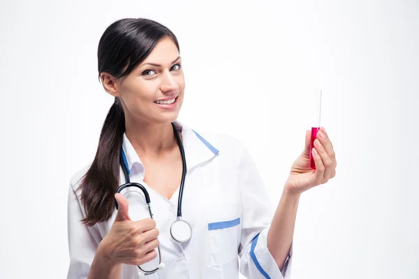 Doctor holding chemical glassware and showing thumb up Royalty Free Stock Photos