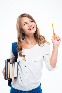 Kitap ve kalem tutan sırt çantası ile kız