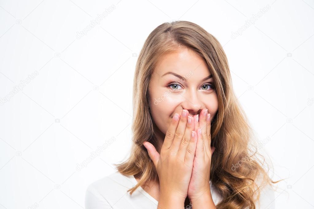 Happy woman covering her mouth