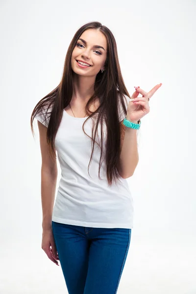 Smiling woman pointing finger away — Stock Photo, Image