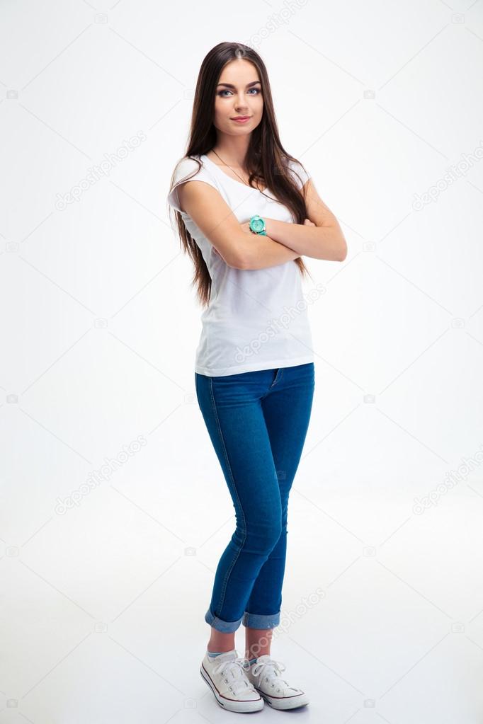 Happy woman standing with arms folded