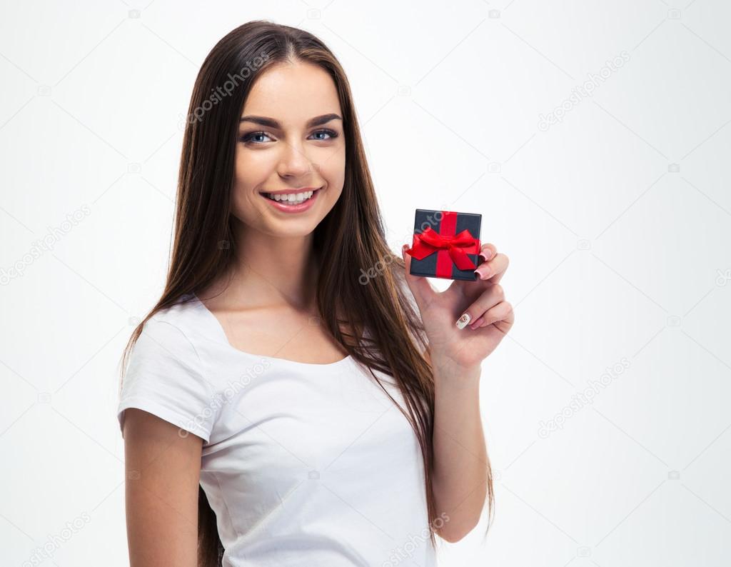 Cheerful young woman holding small gift box 