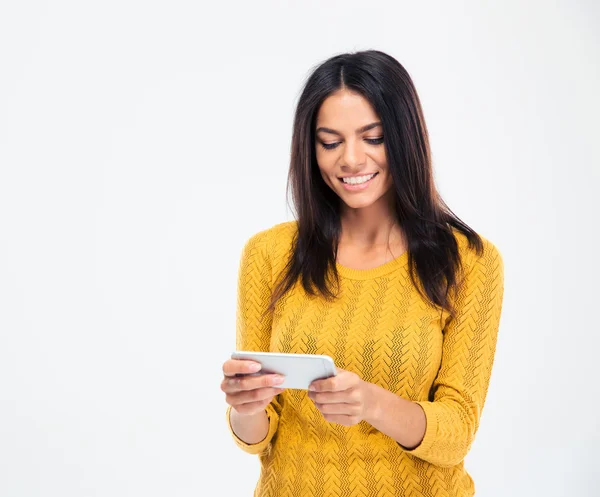 Smiling pretty woman using smartphone — Stock Photo, Image