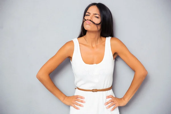 Beautiful woman making mustache