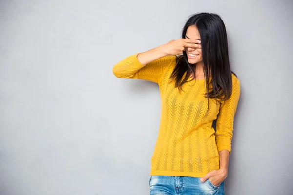 Woman covering her eyes with fingers — Stock Photo, Image