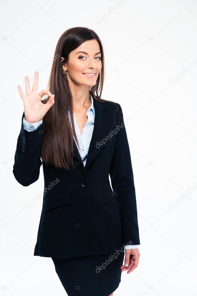 Happy businesswoman showing ok sign
