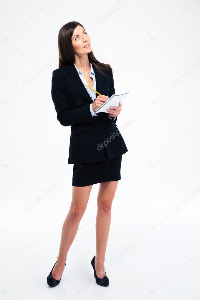 Pensive woman holding pencil with notebook 