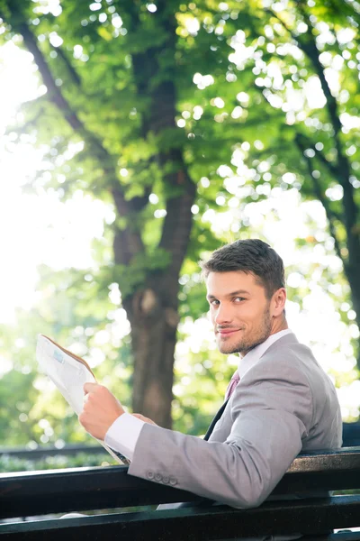 Businessman holding newspaper Royalty Free Stock Images
