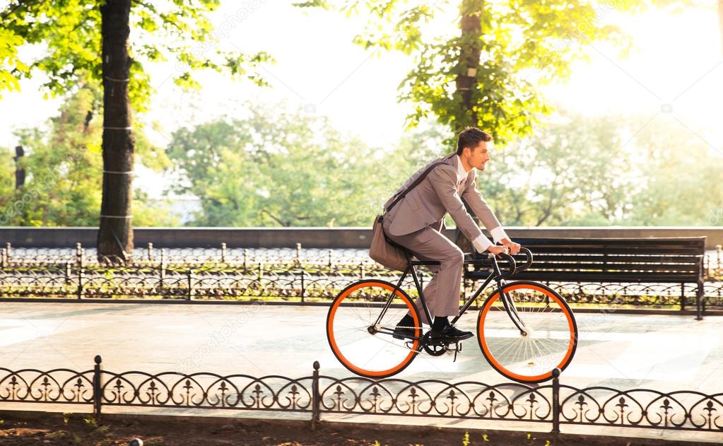 Businessman riding bicycle