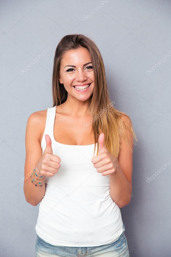 Cute woman showing thumbs up 