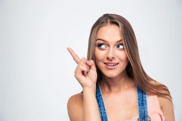 Cute woman pointing finger away — Stock Photo, Image