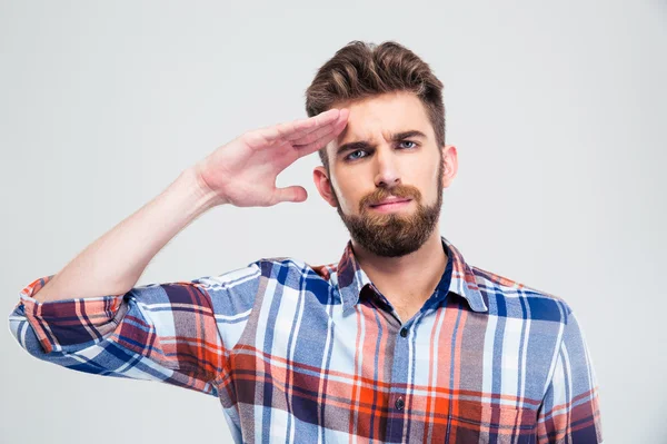 Portrait of a young man saluting — Stock Photo, Image