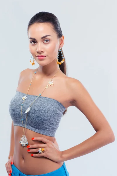 Fashion model posing over gray background — Stock Photo, Image