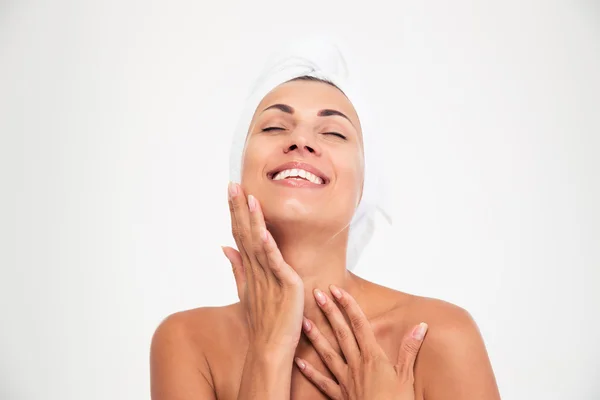 Woman with towel on head touching her fac — Stock Photo, Image