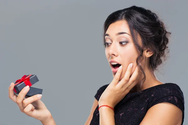 Amazed woman holding gift box Stock Image