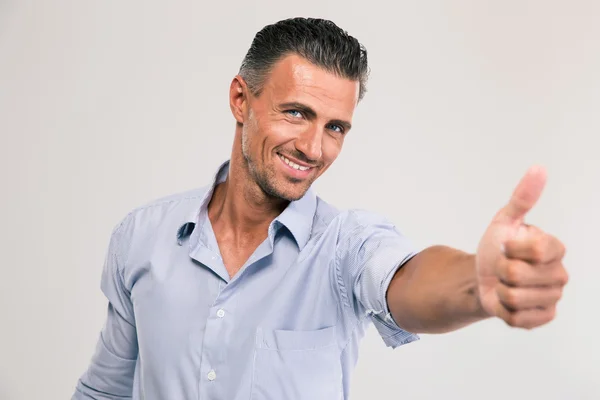 Hombre de negocios mostrando pulgar hacia arriba — Foto de Stock