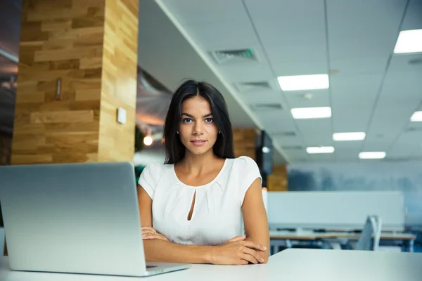 Charming businesswoman sitting at the table — Stock Photo, Image