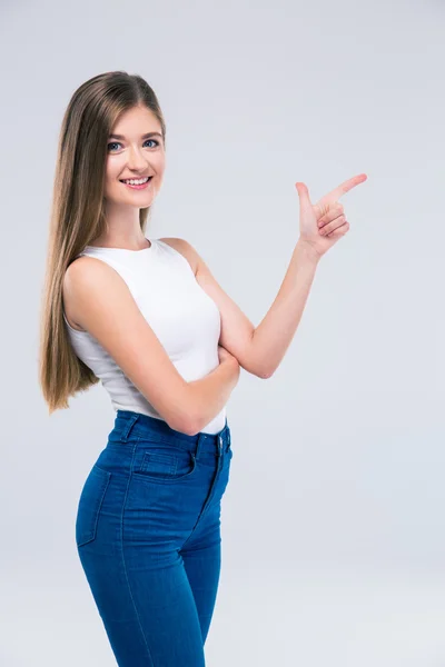 Female teengaer pointing finger away — Stock Photo, Image