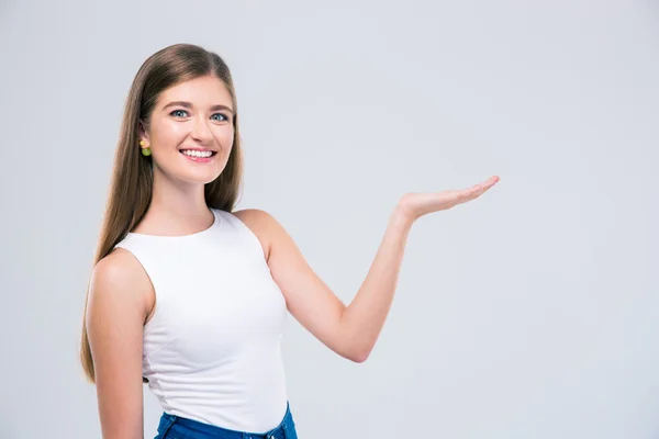 Female teenager showing copyspace on the palm — Stock Photo, Image