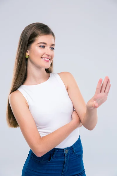 Happy female teenager looking at her nails — Stock Photo, Image