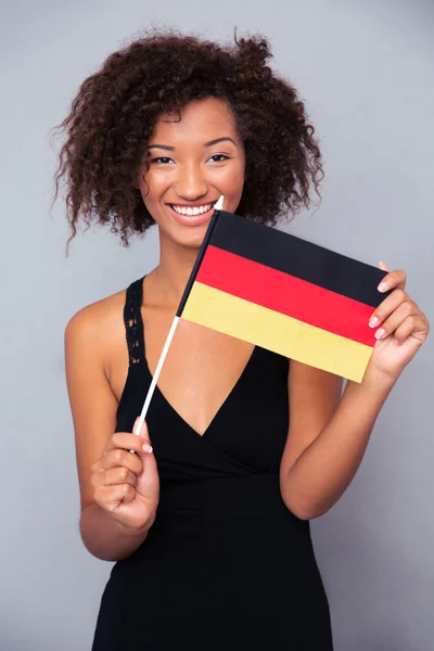 Afro american woman holding Germany flag — Stock Photo, Image