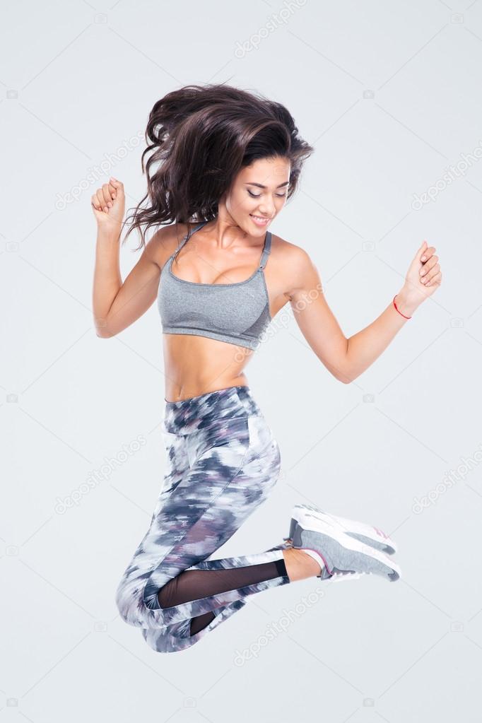 Attractive sports woman jumping