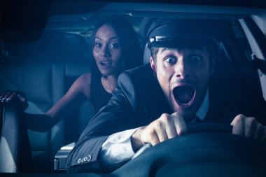 Chauffeur with woman gets into car crash  clipart