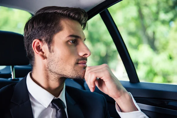 ?usinessman riding in car — Stock Photo, Image