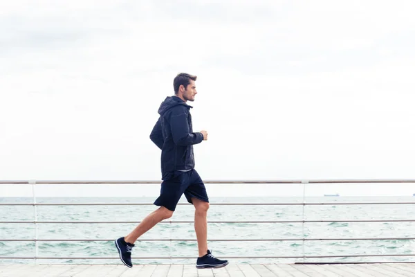 Sports man running outdoors — Stock Photo, Image