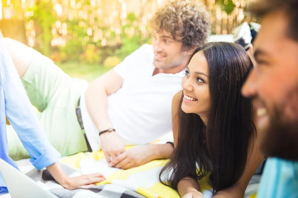 Happy students resting in campus — Stock Photo, Image