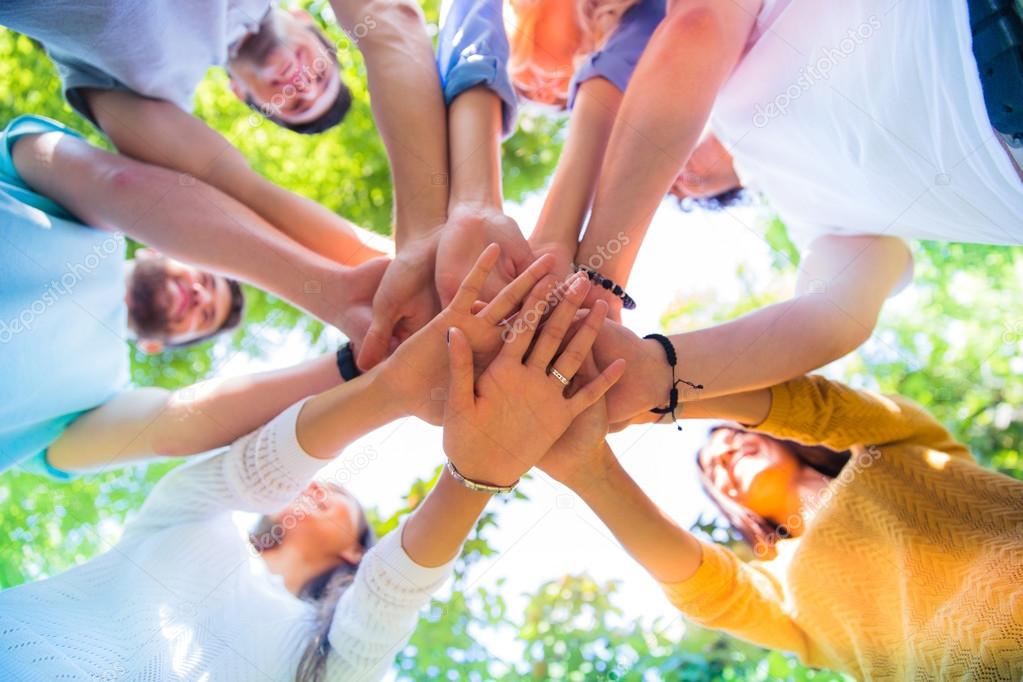 Friends hands together