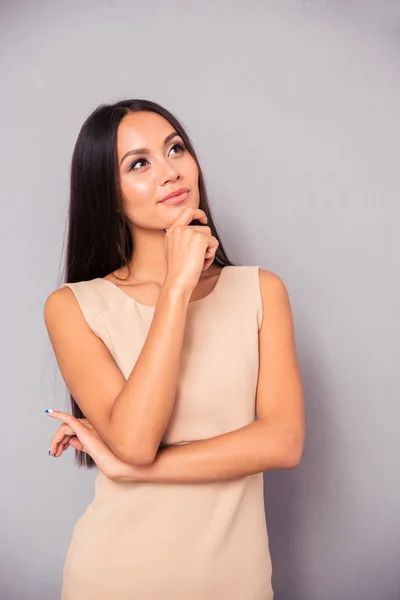 Portrait of a pensive woman in dress — Stock Photo, Image