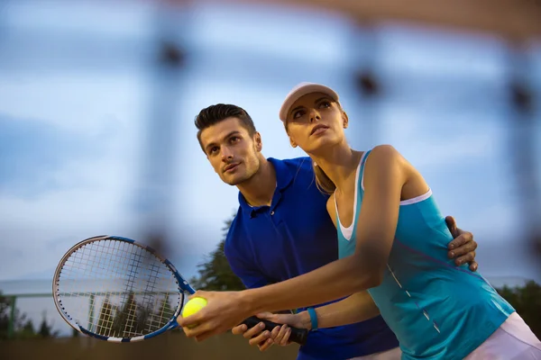 Couple playing in tennis — Stock Photo, Image