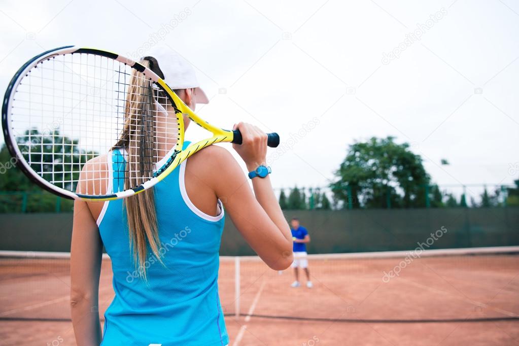 Woman playing in tennis outdoors