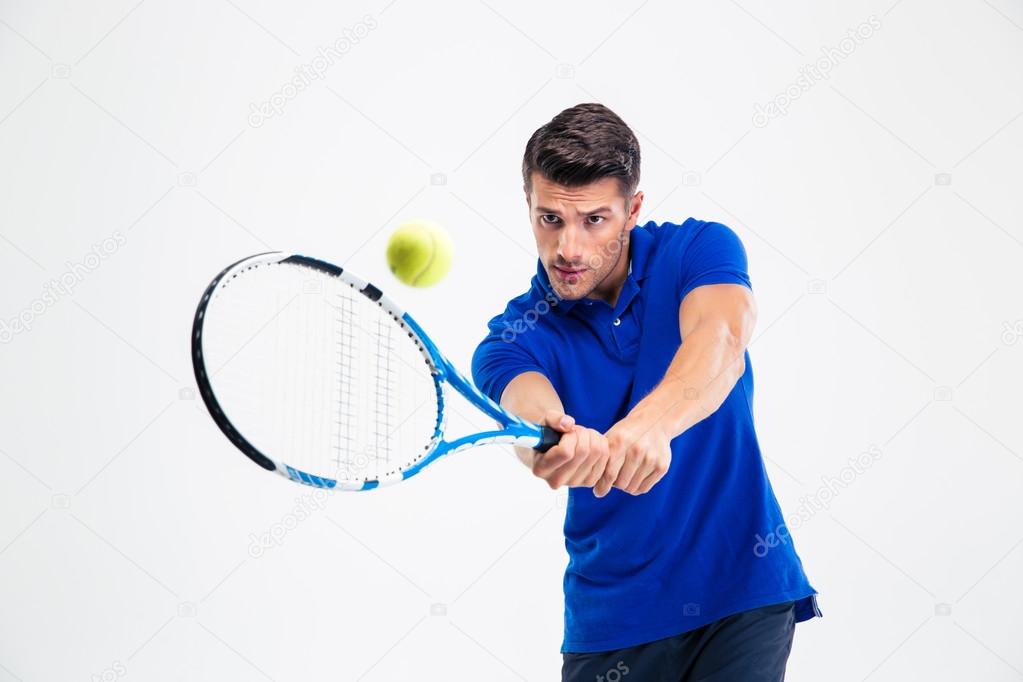 Portrait of a handsome man playing in tennis