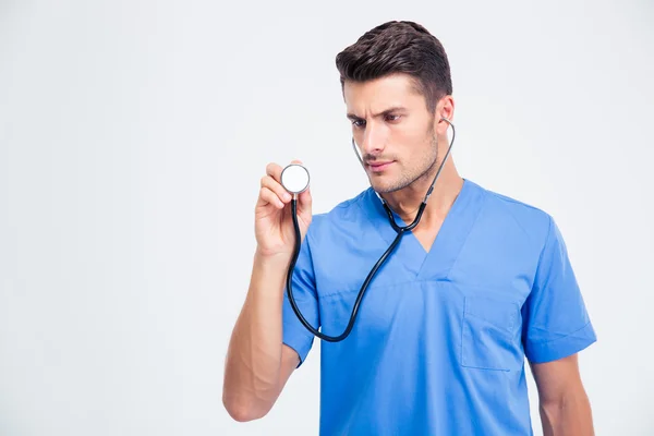 Portrait of a male doctor holding stethoscope — Stock Photo, Image