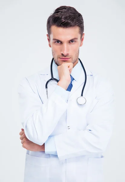 Portrait of a pensive male doctor looking at camera — Stock Photo, Image