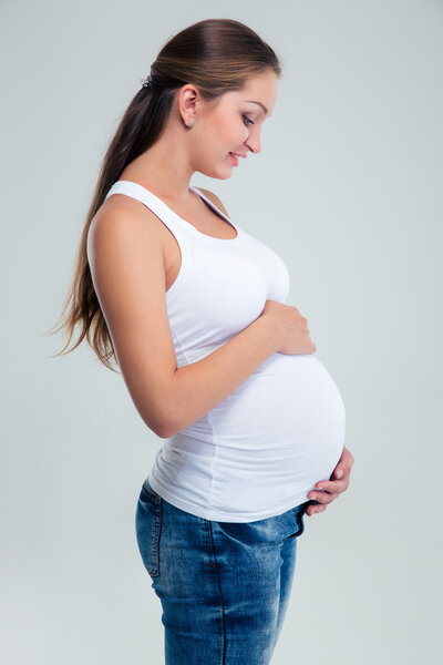 Pregnant woman caressing her belly