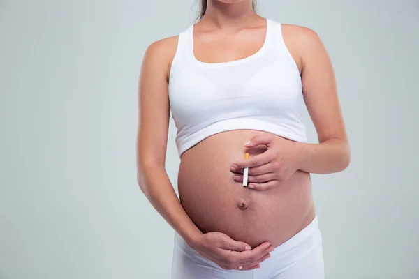 Pregnant woman smoking cigarette — Stock Photo, Image