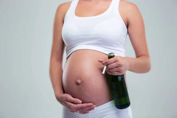Pregnant woman with beer and cigarette — Stock Photo, Image