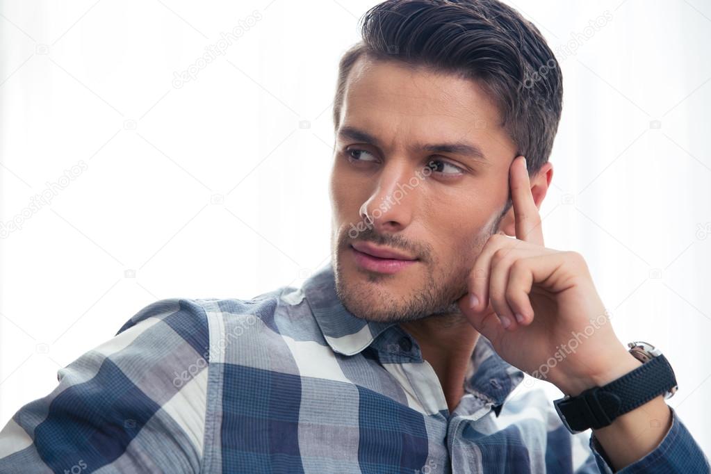 Portrait of a handsome casual man looking away