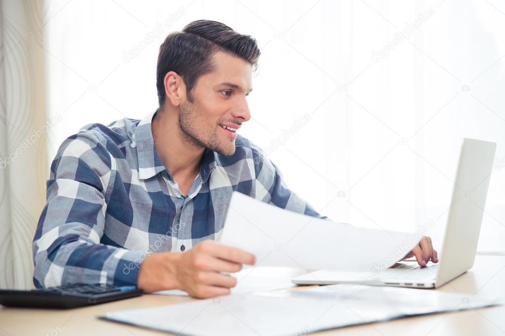 Businessman working at the table in office