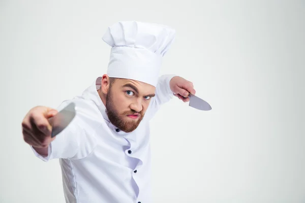 Portrait of angry chef cook holding knifes — Stock Photo, Image