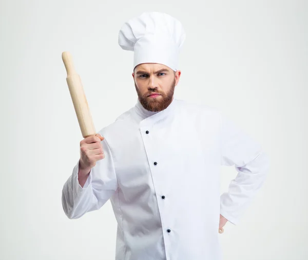 Chef cuisinier sérieux tenant un rouleau à pâtisserie — Photo