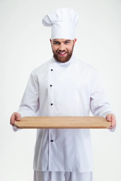 Male chef cook holding wooden chopping board — Stock Photo, Image