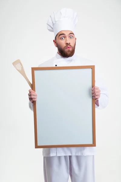 Funny male chef cook holding blank board — Stock Photo, Image